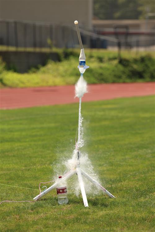 rocket made from a water bottle shooting into the air